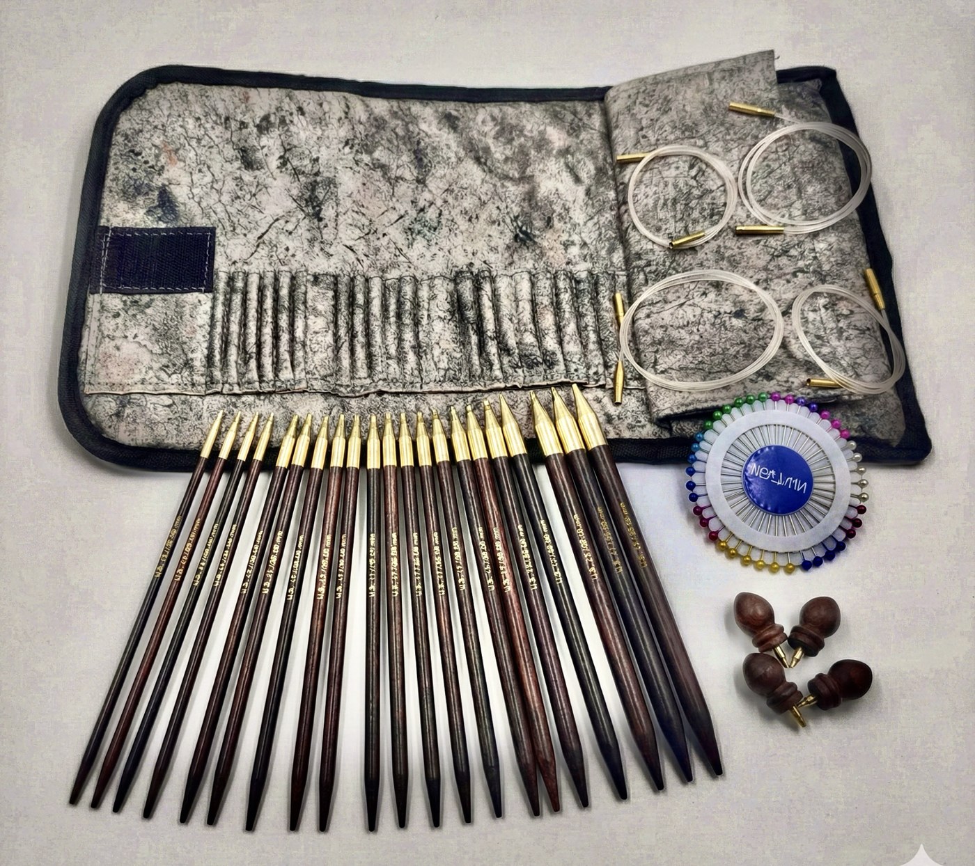 Wooden knitting needles and interchangeable cables in a fabric case